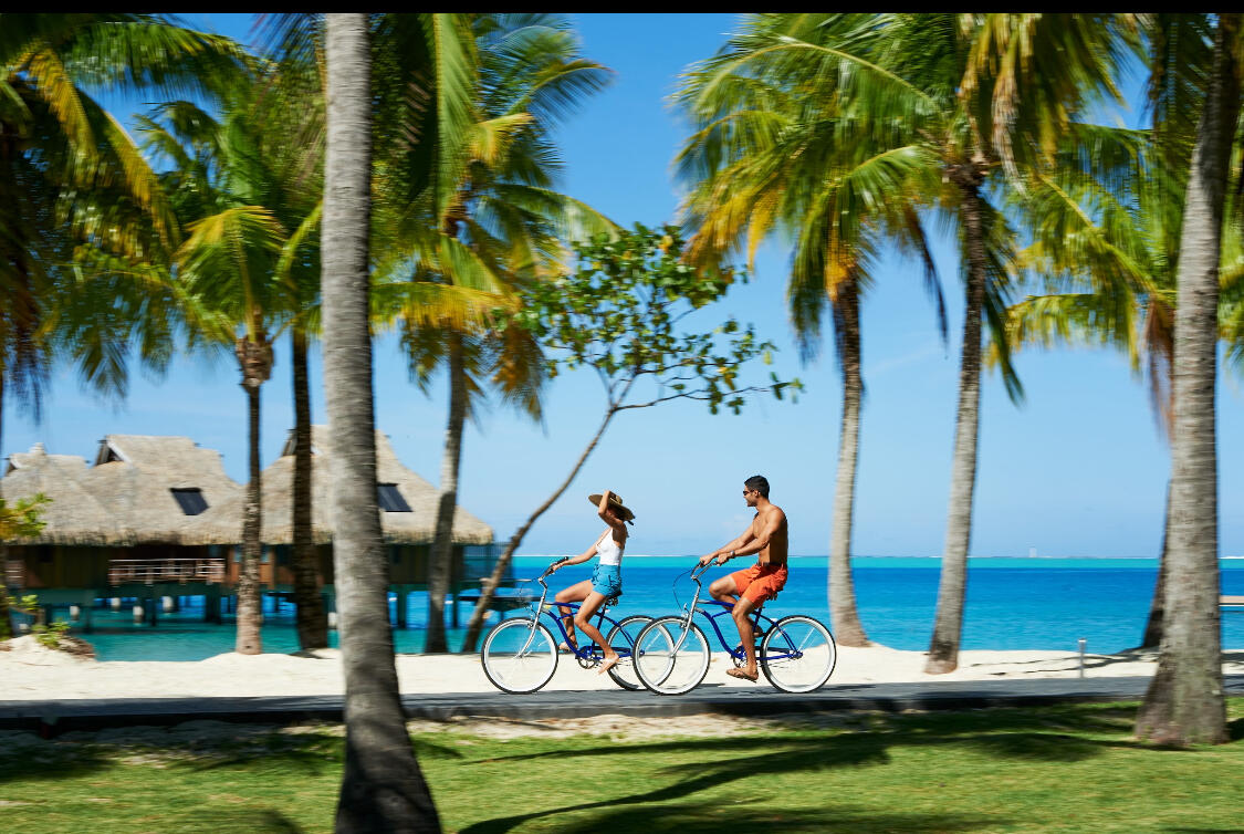 Bicycling along a tropical beachfront in Bora Bora