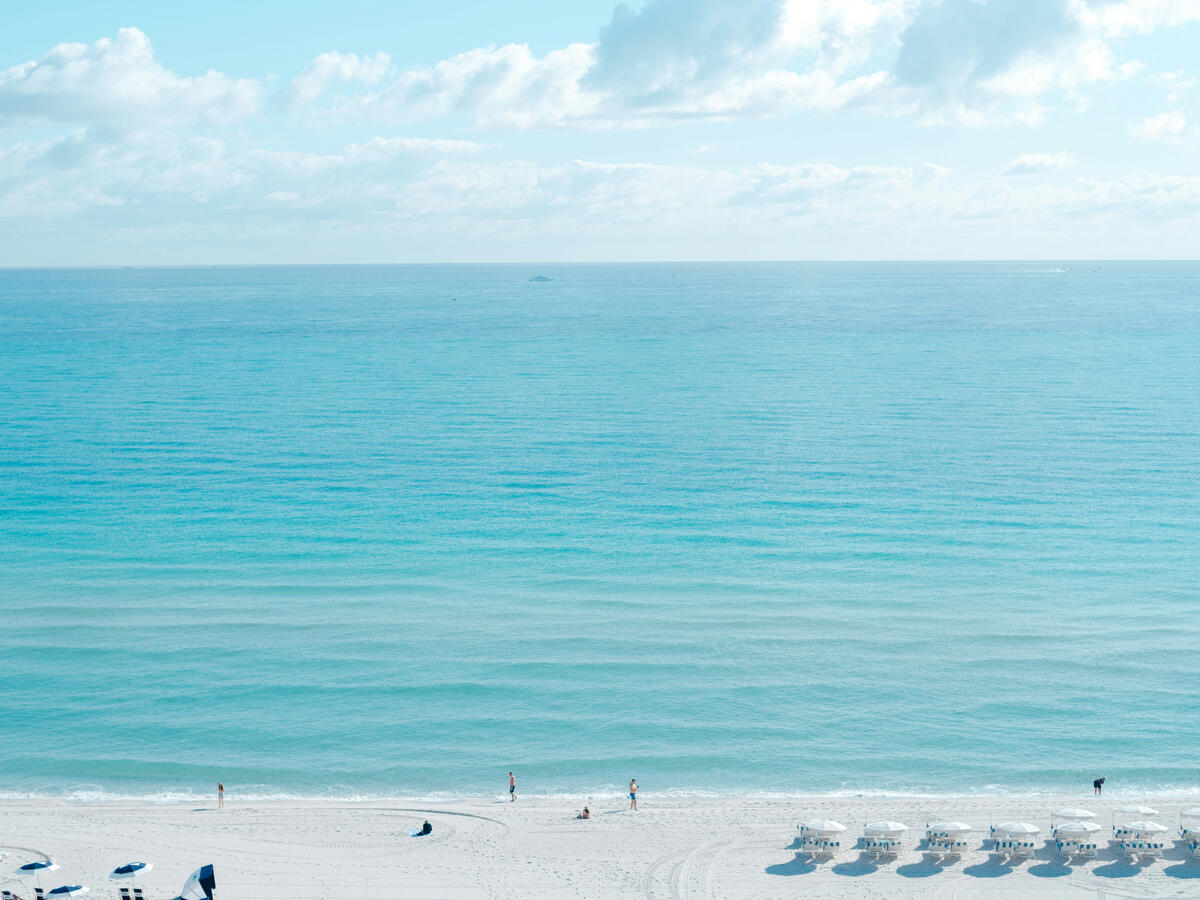 White powdery sand and light blue ocean in Miami Beach Florida